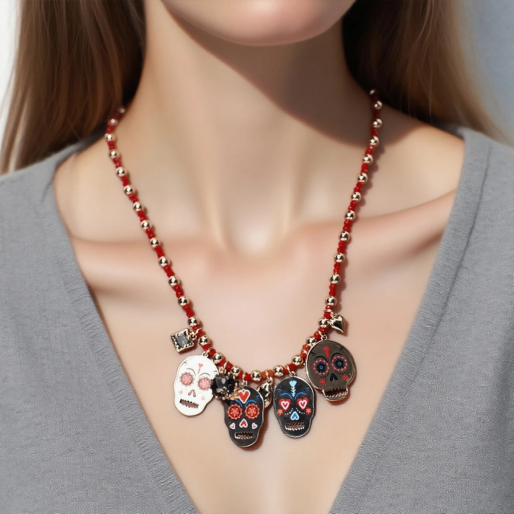 Doodad Co. Rhinestone Skull Drop Earrings — Vintage Halloween Statement Jewelry