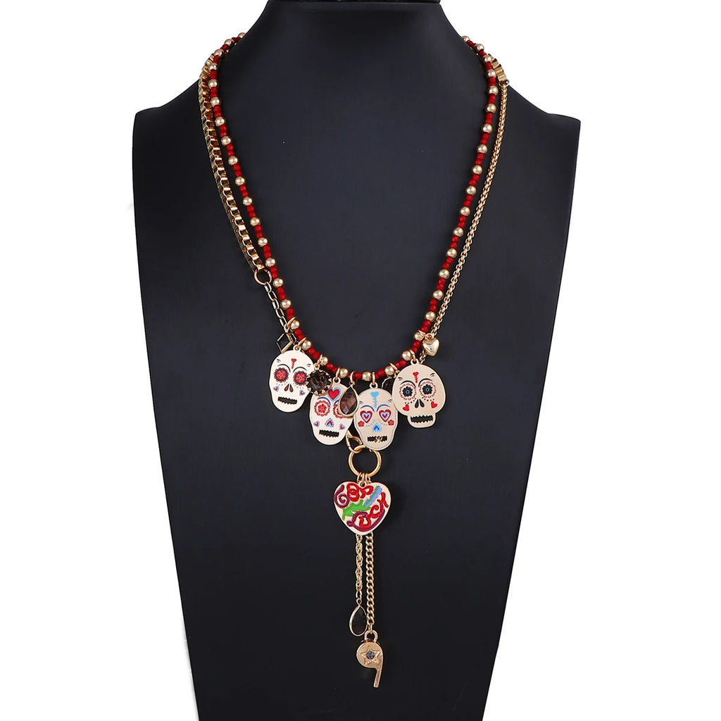 Doodad Co. Rhinestone Skull Drop Earrings — Vintage Halloween Statement Jewelry